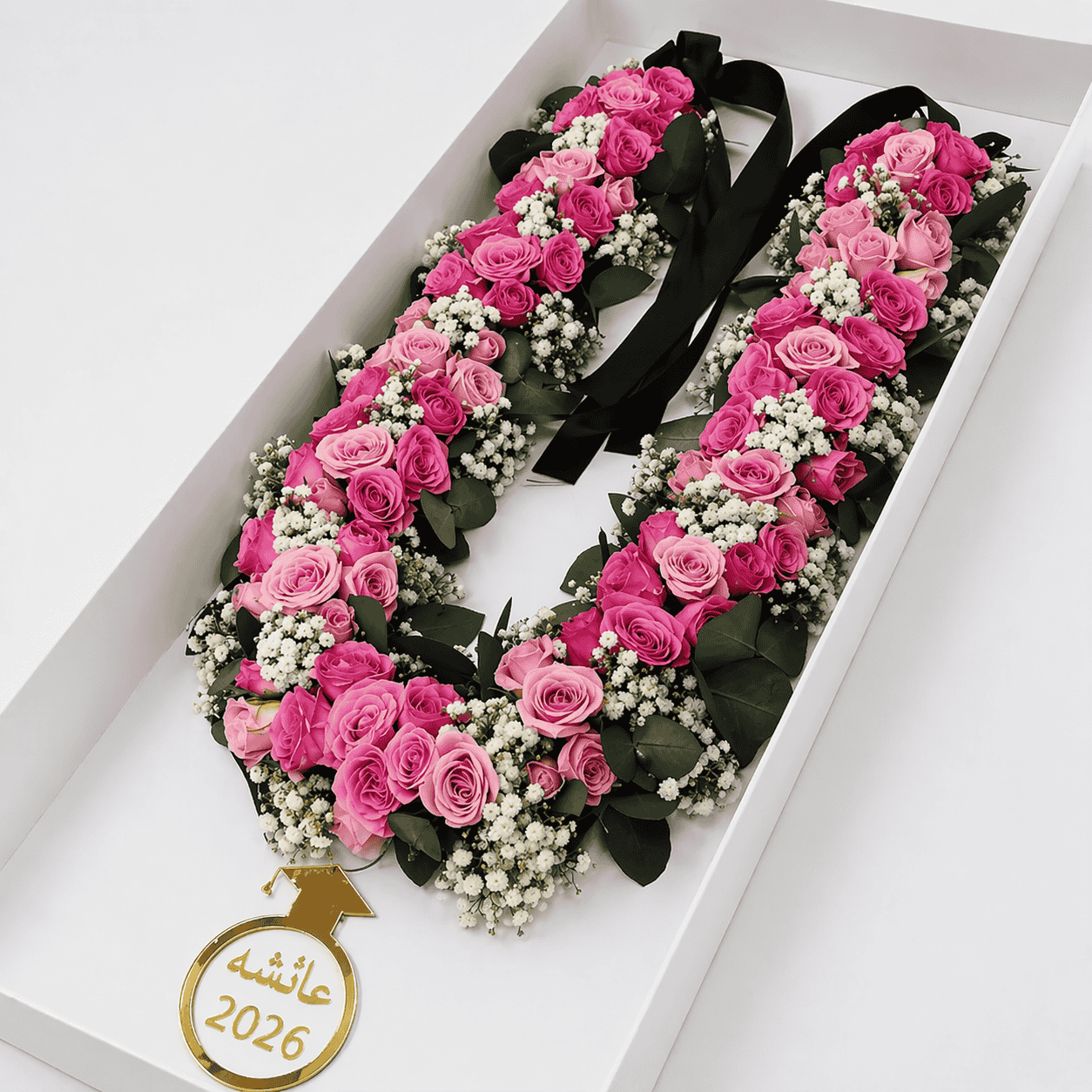 Floral U-shape arrangement with gold tag